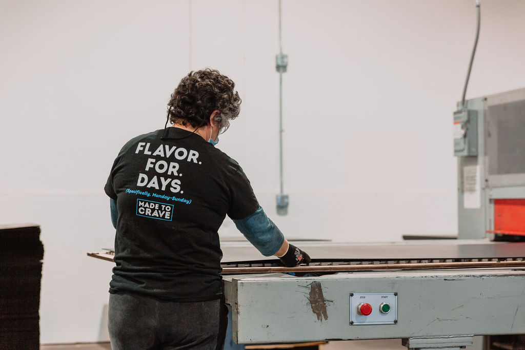 Warehouse worker working with machinery