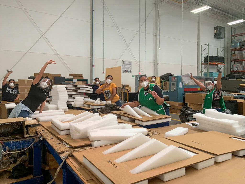 Benefits of a Single Packaging Vendor Blog Post featured image of warehouse workers working on packaging solutions