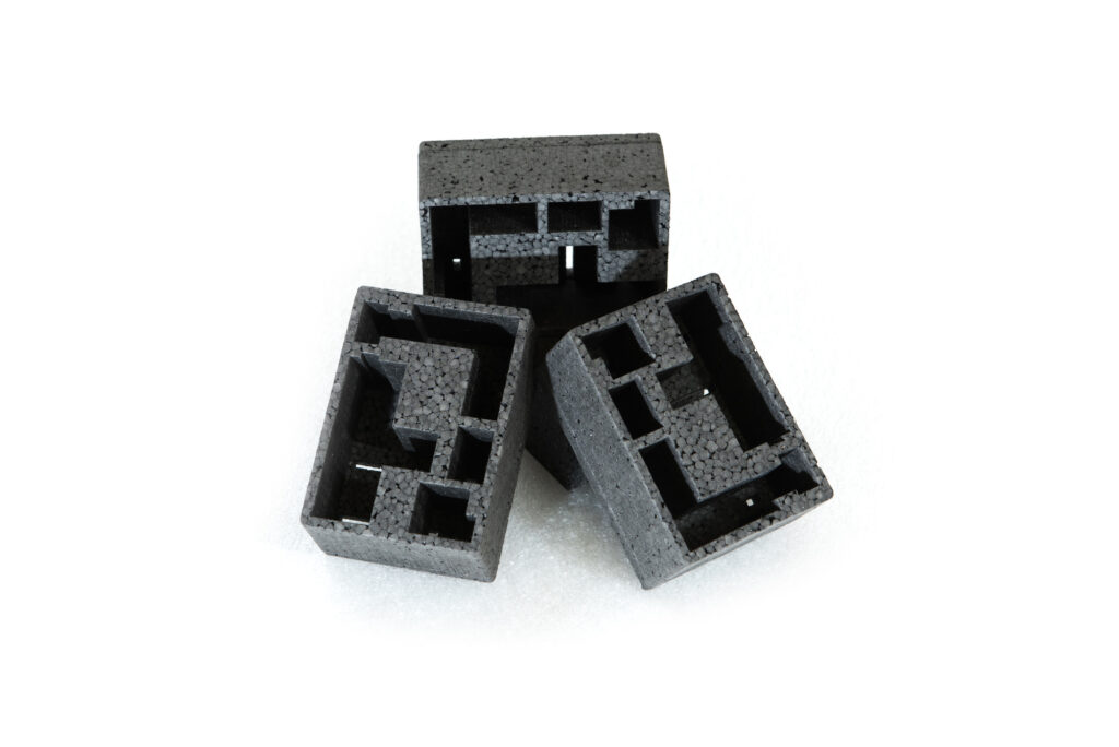 Protective black foam packaging with custom compartments