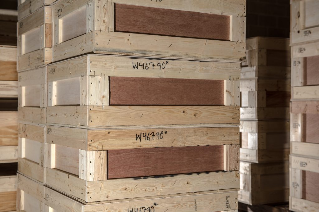Wooden crates stacked in a storage warehouse