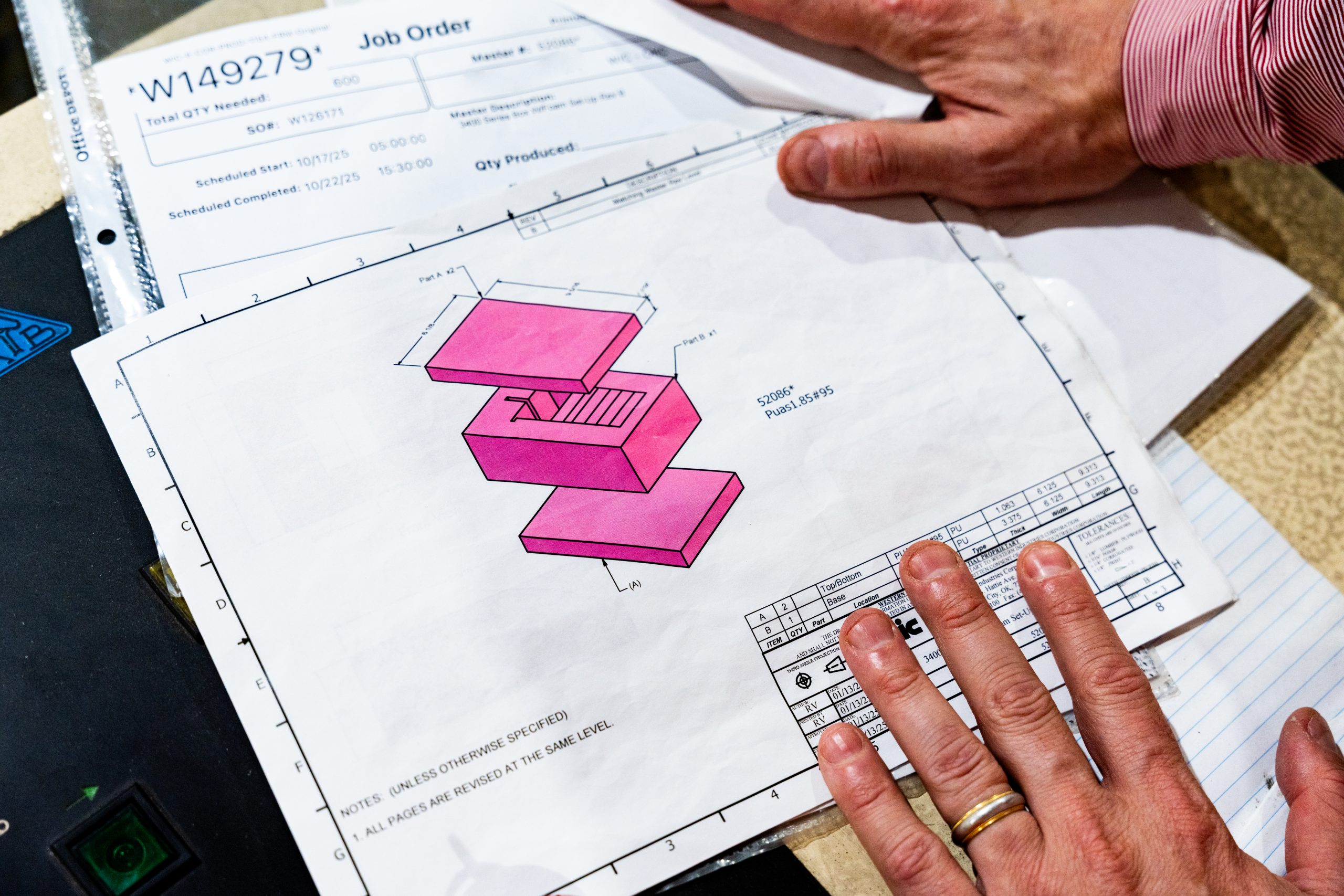 Engineer reviewing architectural 3D blueprint for project