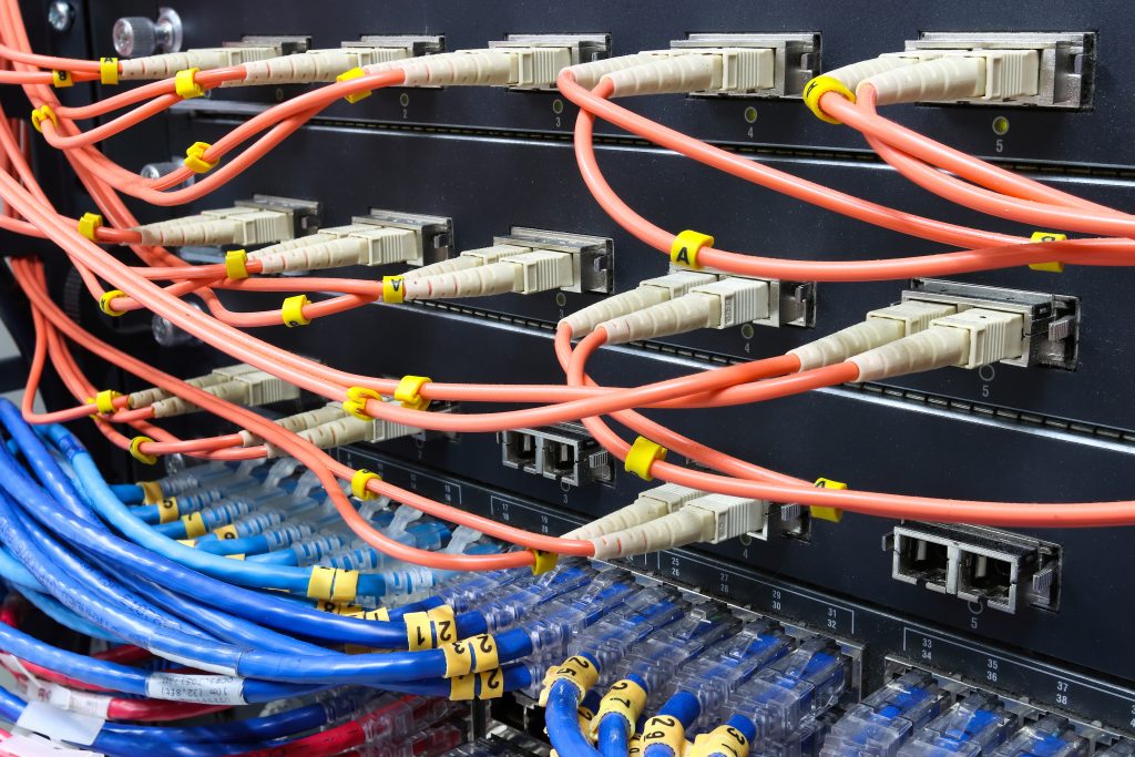 Network cables connected to server equipment in datacenter.