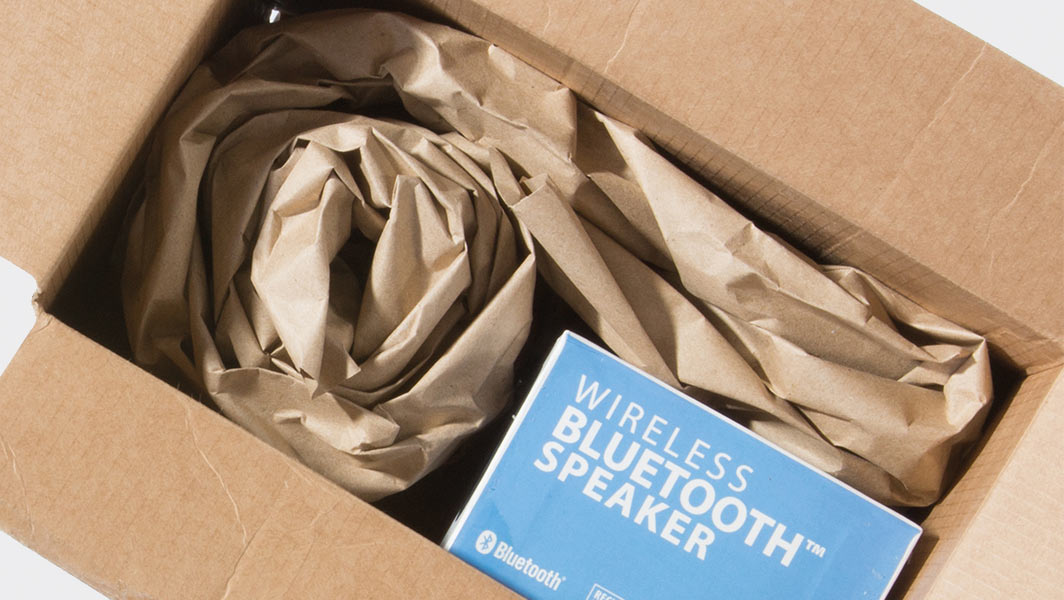 Cardboard box with wireless Bluetooth speaker inside